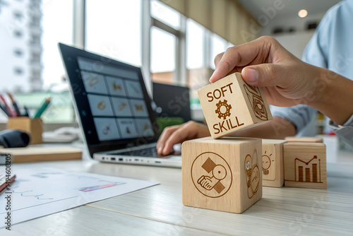 Person stacking wooden blocks with 'SOFT SKILL' text, professional development concept