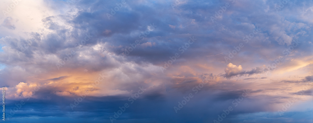 Colorful dramatic clouds during sunset, with layers of light and shadow across the sky. A panoramic view capturing the beauty of changing weather and natural light. Colorful dramatic clouds during sunset, with layers of light and shadow across the sky. A panoramic view capturing the beauty of changing weather and natural light.