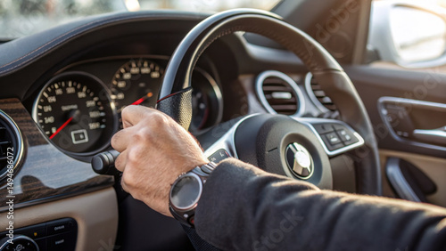 Close-up of driver’s hand turning ignition, dashboard details. Generative AI. 