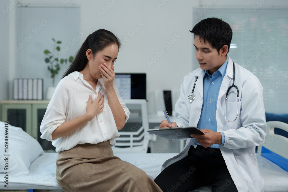 Doctor visiting sick patient in hospital room taking notes Doctor visiting sick patient in hospital room taking notes