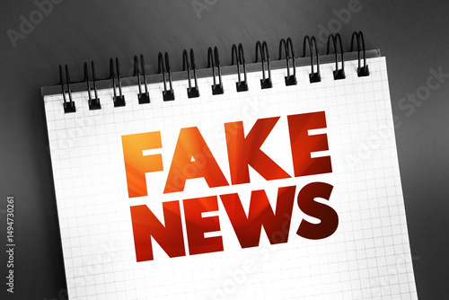 Fake News text on notepad, concept background