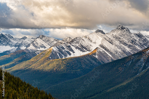 Snow covered, morning sunlight at Sundance Peak in Banff National Park in autumn, Alberta, Canada.