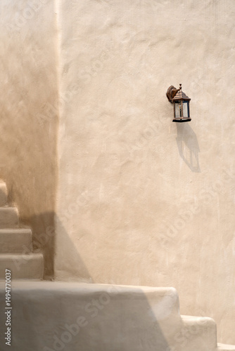 Vintage wall lamp light bulb decoration at the Clay House. Architect of the clay house. Building close to nature that reduces heat from outside. Economic environment-friendly idea exterior outdoors.