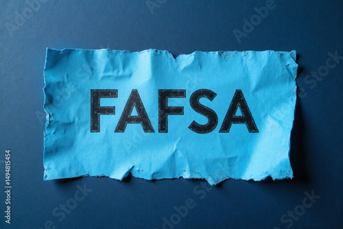 torn piece of paper with the word FAFSA written on it