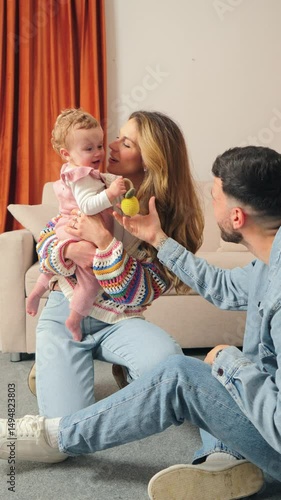 Vertical. Delightful heartwarming moments of loving parents showering kisses on their joyful baby, showcasing the pure essence of family love and the sweetness of parenthood.
