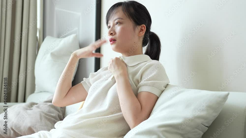 Young Asian woman feeling hot in summer Young Asian woman feeling hot in summer
