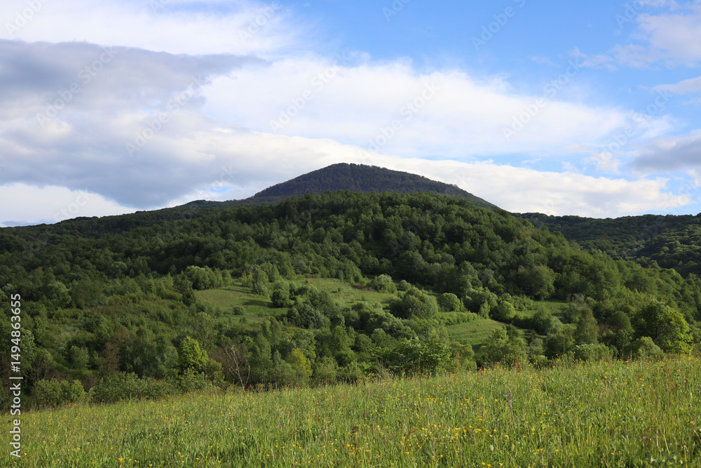 landscape. green mountains and blue sky with white clouds landscape. green mountains and blue sky with white clouds