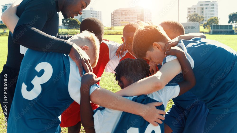Obraz premium Huddle, soccer and coach with group of children on field for motivation, game plan and strategy. Competition, training and practice with kids outdoor for youth sports, football player and support