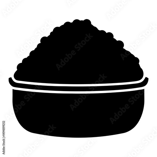 A bowl filled with a heap of textured material in silhouette