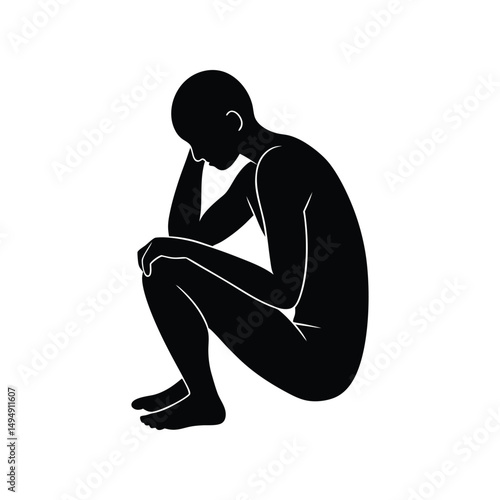 Silhouette of a Person Sitting in a Posture of Despair and Reflection