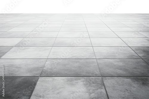 A low angle shot of a gray tiled floor with a dark background showing the floor texture and pattern detail