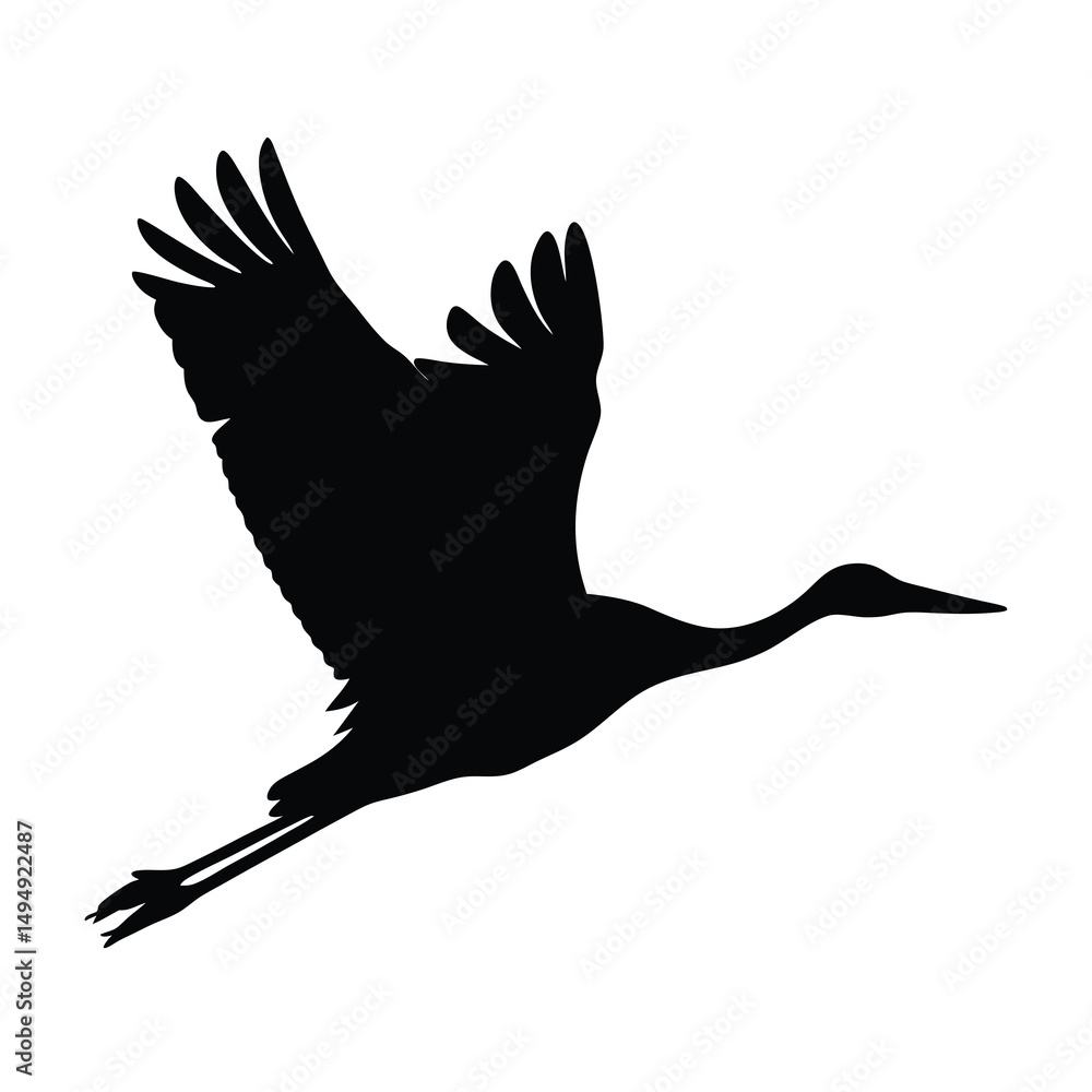 Obraz premium Silhouette of a crane soaring, wings spread against a white background