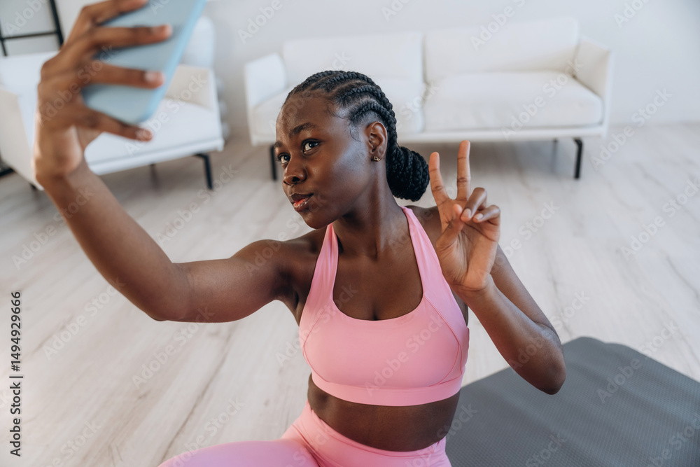 Selfie time. Woman is doing yoga at home Selfie time. Woman is doing yoga at home