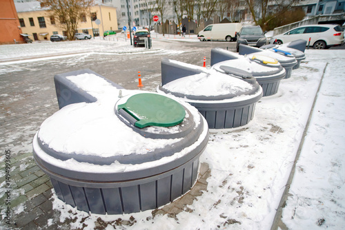 Advanced underground trash bin system with cylindrical containers, revolutionizing urban waste disposal by offering a hygienic, space-saving, and eco-conscious approach to garbage collection