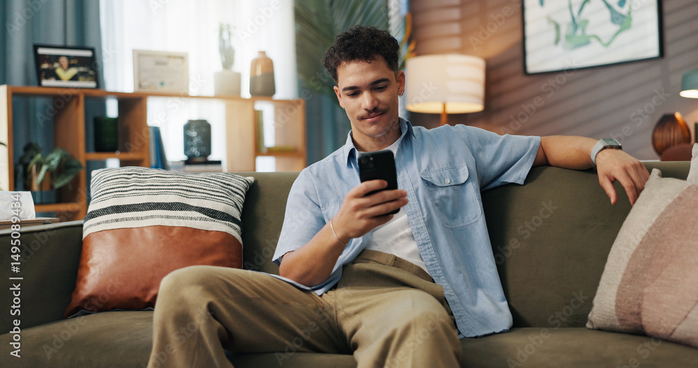 Obraz premium Relax, smile and man with mobile in home for communication, chat and reading message. Sofa, online and happy person with smartphone for texting, social media and browsing website to download app