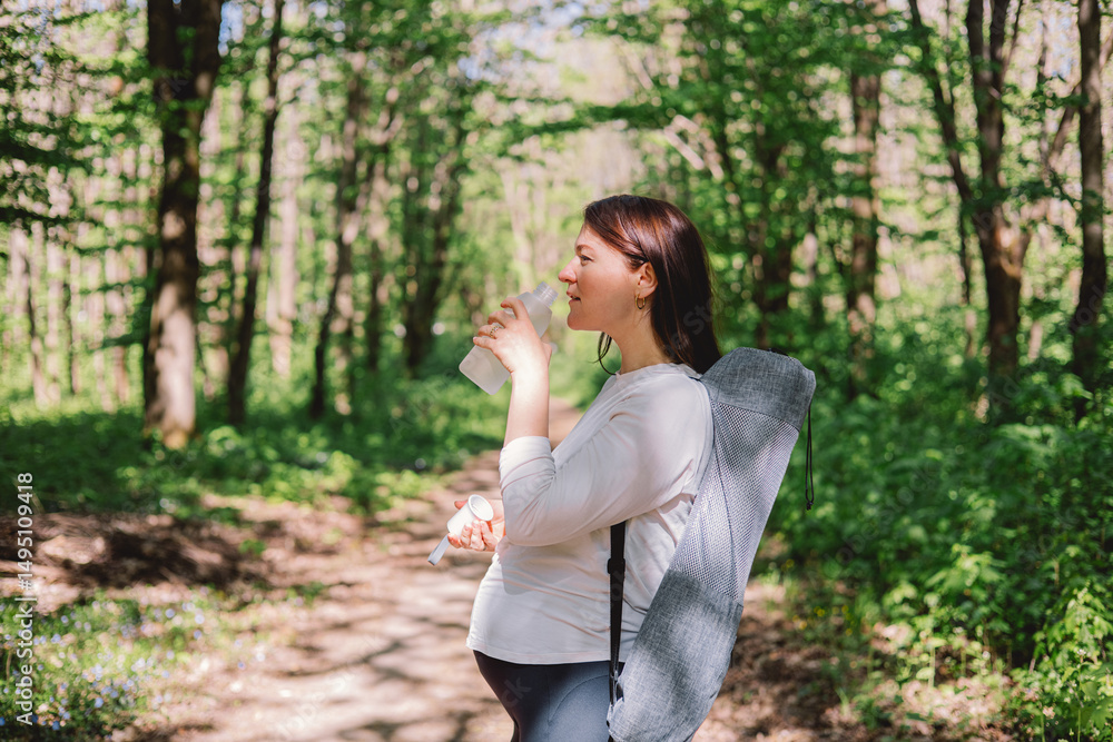 Pregnant woman doing fitness outdoors. Pregnant woman doing fitness outdoors.