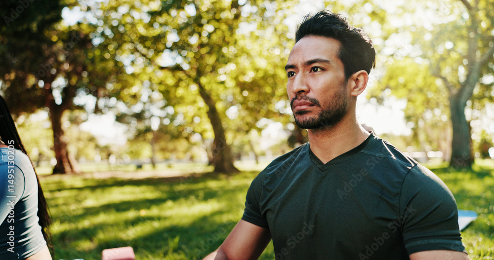 Fototapeta premium Man, park and serious for yoga with mindfulness, thinking or calm balance with health, wellness and exercise outdoor. Person, class and reflection for peace of mind, fresh air and fitness in nature