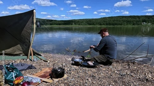 Cooking food over a fire outdoors