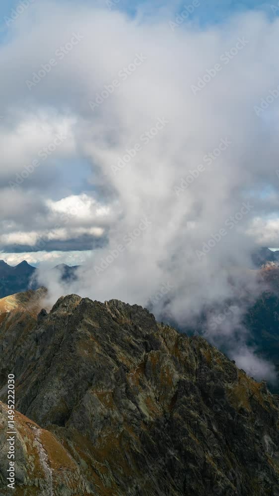 Tatra Topography: Clouds Dance Over Rugged Peaks Tatra Topography: Clouds Dance Over Rugged Peaks