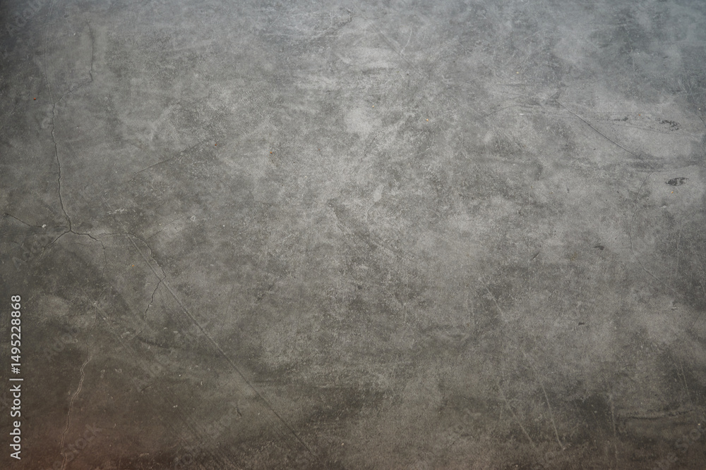 Obraz premium A grey wall with a few scratches on it. The wall is made of concrete. There are no people or objects visible in the image