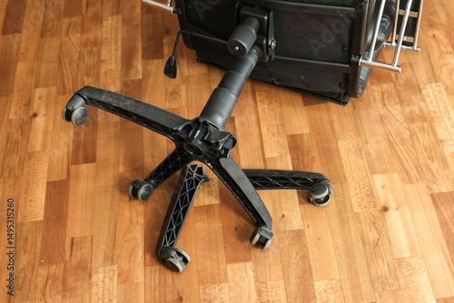 An office chair floor with broken legs: a symbol of poor workmanship and the need for repairs.