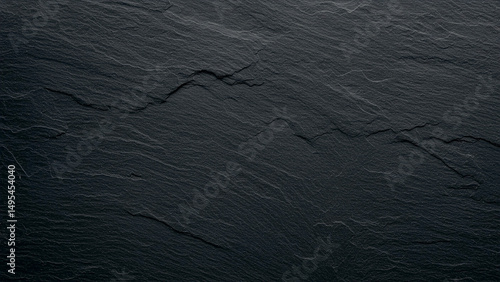 Slate Stone Texture: A close-up shot of a textured dark grey slate stone, revealing its unique and elegant, the subtle variations and natural characteristics that make each piece of stone unique