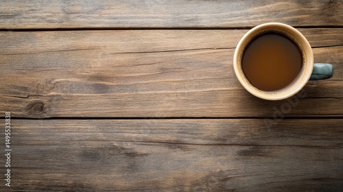 Close-up of coffee cup on wooden backdrop with empty space.