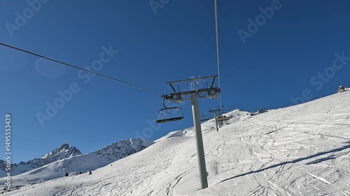 Ski lifts going up and down in Courchevel ski resort