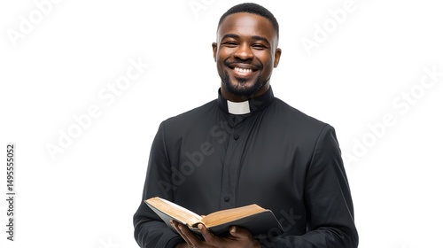 Stock photo of african american priest smiling holding bible on white background for religious content
