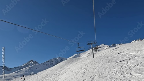 Ski lifts going up and down in Courchevel ski resort
