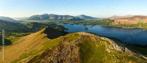 Fotografia Aerial panorama of Catbells mountain ridge with Derwent Water and Keswick town b