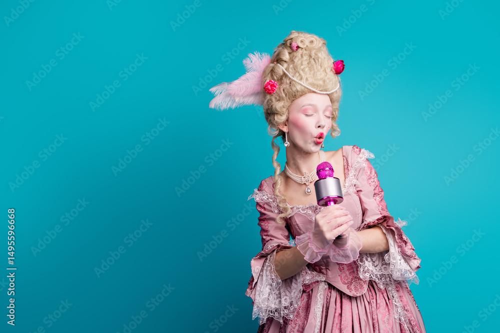 Fototapeta premium Photo of attractive gorgeous queen wear pompous ruch gown hold mic sing isolated on blue color background