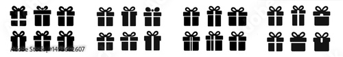 Collection of black gift boxes with bows arranged in rows for celebration or special occasions