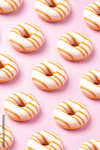Wallpaper Mural Pattern of delicious glazed donuts on pastel pink background. Sweet treat or dessert concept Torontodigital.ca