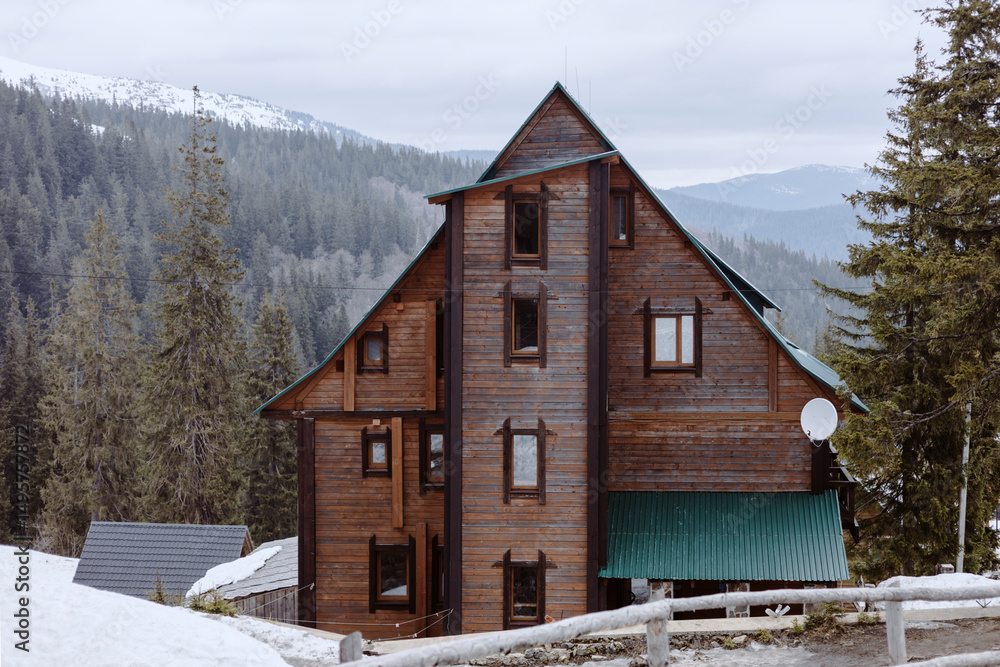 Big wooden house in winter in snowy mountains. Country house. Big wooden house in winter in snowy mountains. Country house.