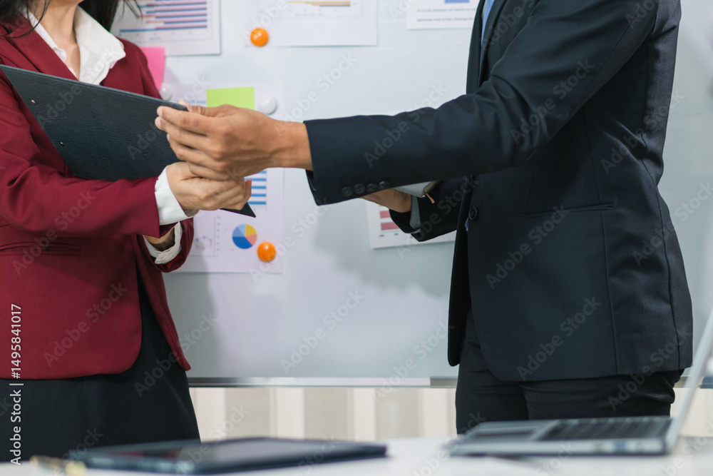 Fototapeta premium Businesswoman talking to business consultant to make decision on new business investment to make more productive and consultant also give advice on statistics on customer demand including good profit.