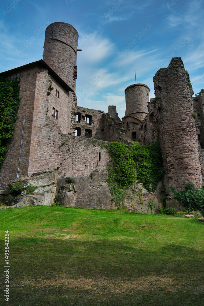 The Majestic and Enigmatic Ruins of an Ancient Castle are Beautifully Surrounded by Lush Greenery The Majestic and Enigmatic Ruins of an Ancient Castle are Beautifully Surrounded by Lush Greenery