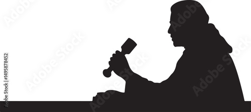 Silhouette of a Person Holding a Gavel at a Table