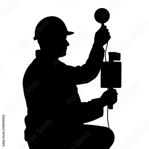Silhouette of a male oil and gas industry worker measuring with a device against a plain white background, professional concept of engineering or energy services