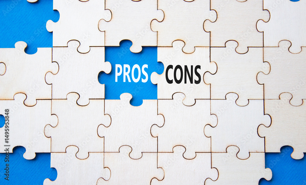 Fototapeta premium Pros vs Cons symbol. Concept word Pros vs Cons on wooden puzzle. Beautiful blue background. Business and Pros vs Cons concept. Copy space