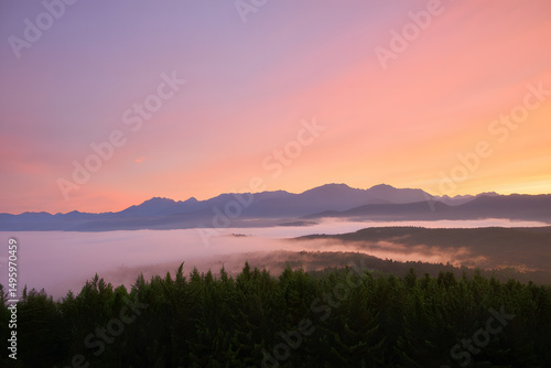 Beautiful sunrise and sunset over peaceful water and mountains