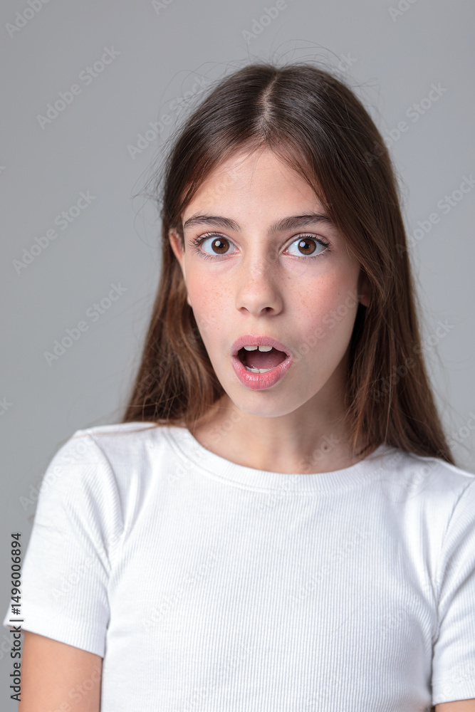 Portrait of a beautiful teenage girl with long hair in black leggings and a top in a photo studio on a white background. Different emotions. Emotional shot. Model. Photo model. Photo session. Portrait of a beautiful teenage girl with long hair in black leggings and a top in a photo studio on a white background. Different emotions. Emotional shot. Model. Photo model. Photo session.