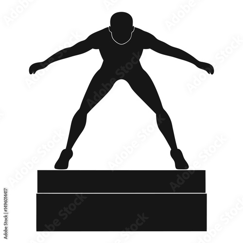 Silhouette of Athlete Preparing for a Jump on a Platform