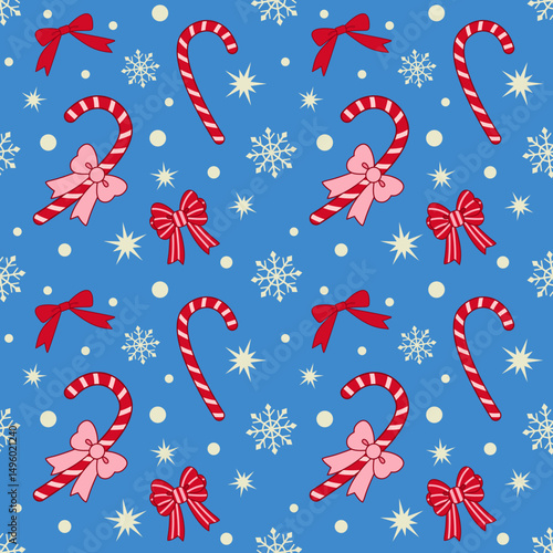 Seamless Christmas pattern with red bows and candy canes on blue background. Season greetings wallpaper.