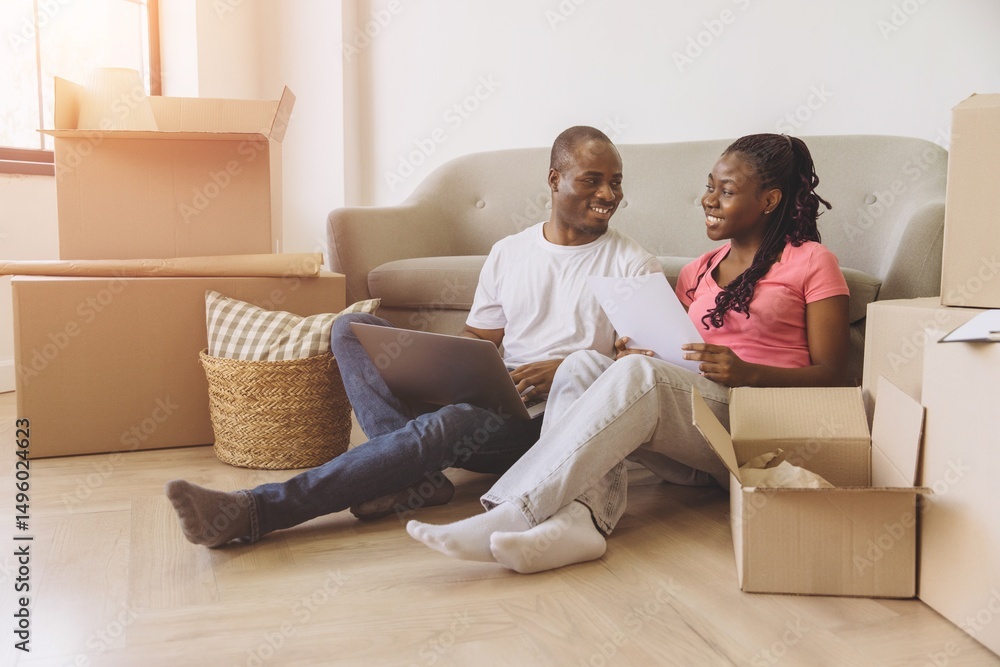 Young African American Couple Organizing Move in New Apartment Young African American Couple Organizing Move in New Apartment