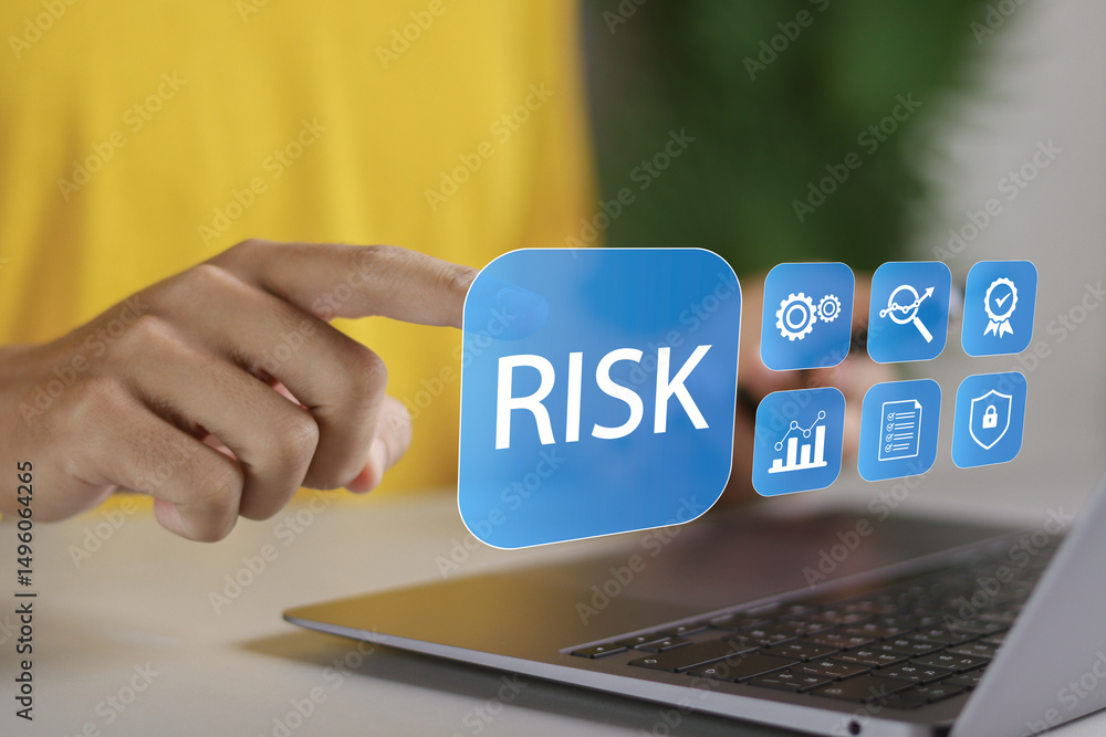 Risk management concept, Risk assessment. Person using laptop to ...