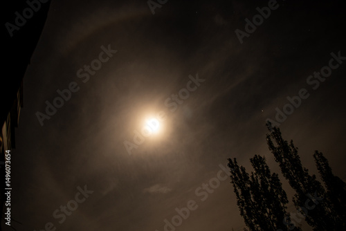 Halo around the moon at night in the sky over Ukraine in the city of Dnipro