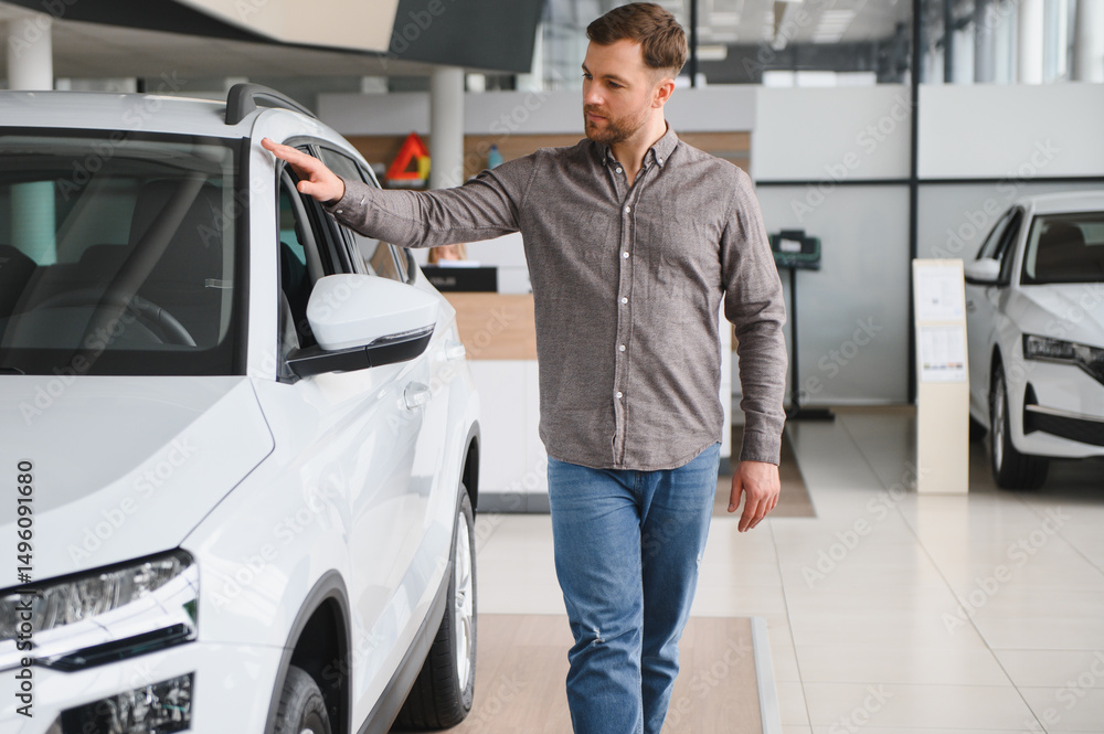 Customer choosing new white car in dealership showroom Customer choosing new white car in dealership showroom