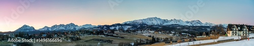 Obraz na płótnie Tatra mountains peak at sunrise seen from Murzasichle village. Winter in Polish mountain region w salonie