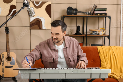 Young happy male composer w...